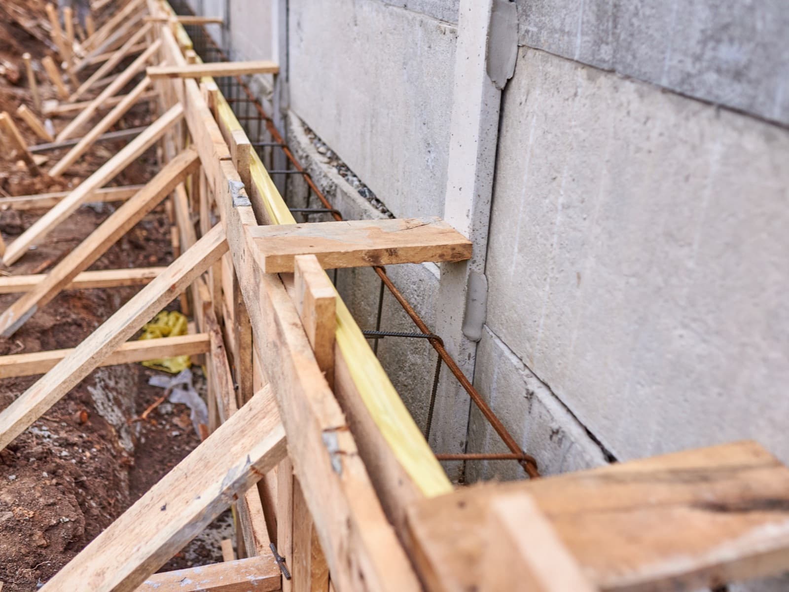 Foundation construction with wooden forms and stee.
